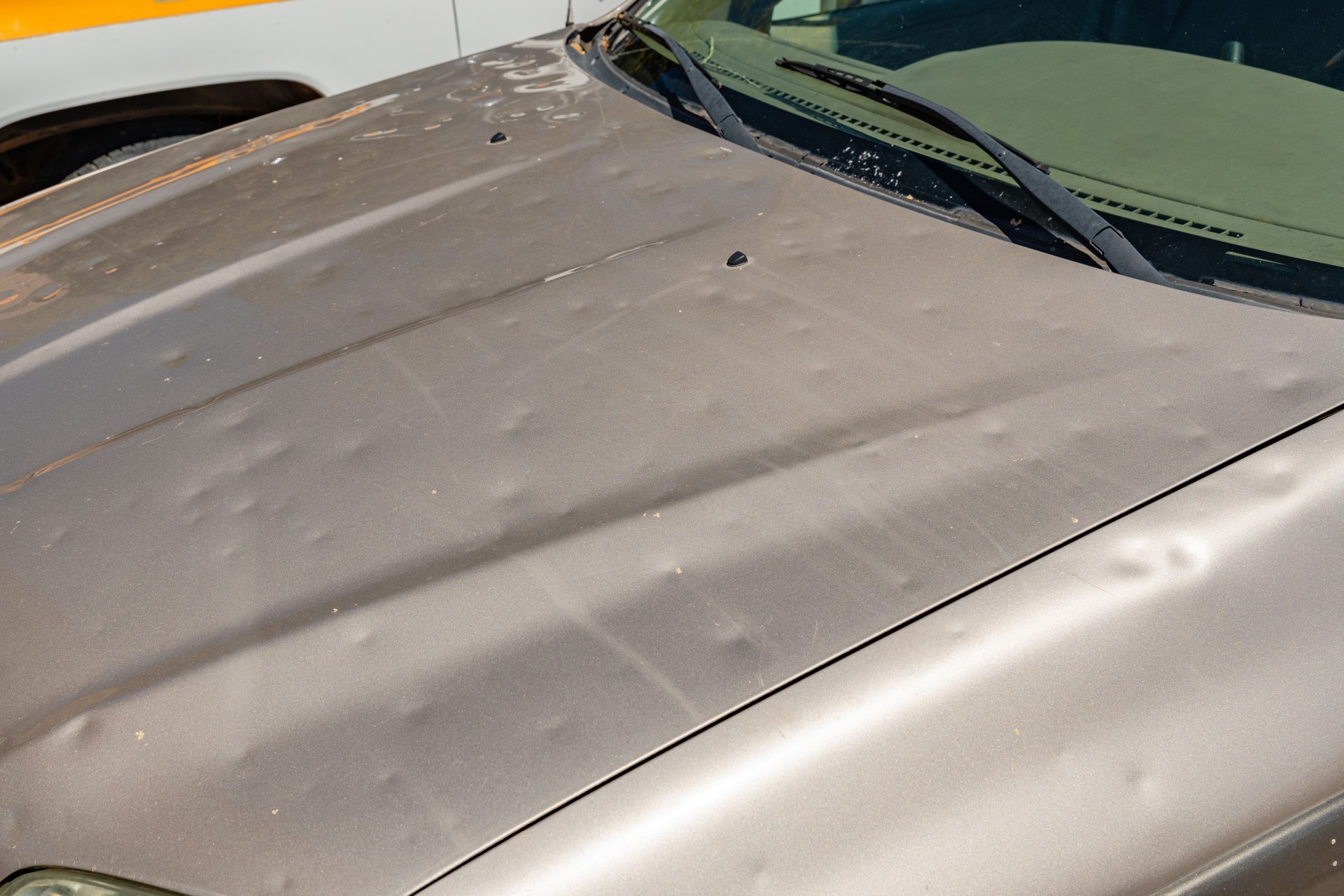 Car hood with hail damage